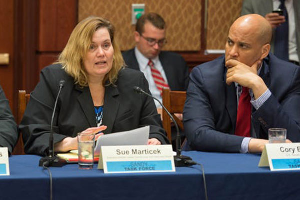 Susan Marticek speaking at a Sandy Task Force meeting in Washington DC with Senator Cory Booker